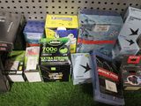 a pile of assorted electronics on display in a store