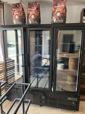 a display case that has two bags of chips on top of it