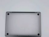 a close up of the bottom of a laptop with a white background
