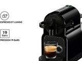 a close up of a coffee machine with a cup of coffee