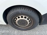 a white car with a flat tire that has holes in it