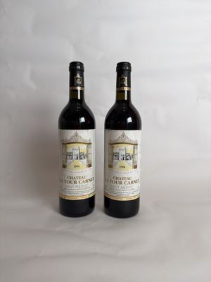 two bottles of wine sitting next to each other on a table