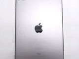 an apple ipad sitting on top of a white table next to a white wall