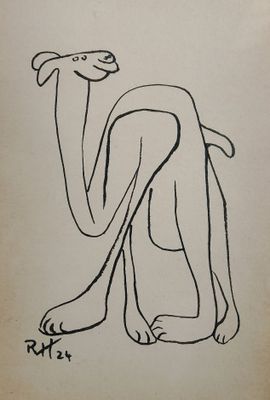 an old book with a drawing of a dog sitting on the floor