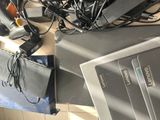 a lot of wires and cords that are on top of a laptop