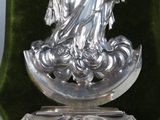 a statue of a woman holding a baby on a pedestal