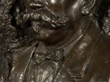 a statue of a man with a mustache and a moustache