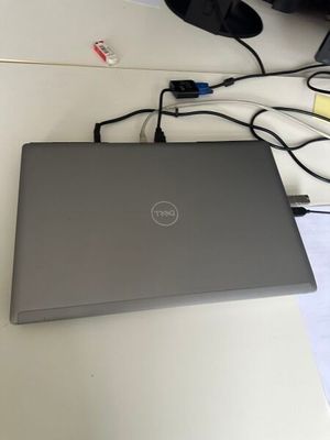 laptop on a desk with a mouse, keyboard, and mouse pad