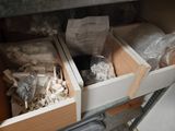 two wooden boxes that are filled with items in them