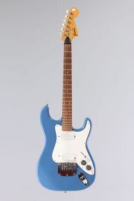 a blue electric guitar sitting on top of a stand