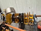 a bunch of tools that are hanging on the wall