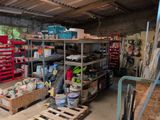 a garage filled with lots of tools and supplies