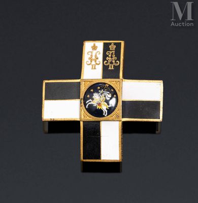 a close up of a cross on a black surface