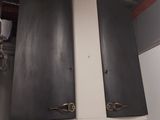 two ovens that are on top of a shelf