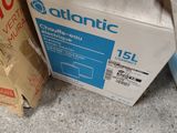 a cardboard box sitting on the floor next to a cardboard box