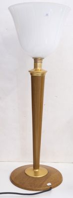 an image of a lamp that is on a wooden table