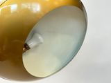 a yellow lamp that is on a white table