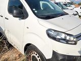 a white van that is parked in the grass