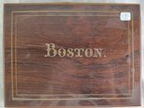 an old wooden box with the word boston written on it