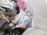 a pile of toiletries and personal care items in a plastic bag