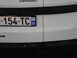 a close up of a white car with a number plate on it