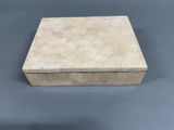 an empty box sitting on top of a table with a blue background
