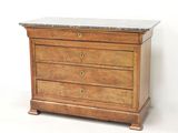 a wooden chest of drawers with a marble top