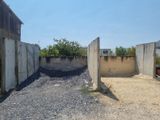a concrete wall that is next to a concrete wall