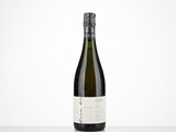 a bottle of white wine sitting on top of a table