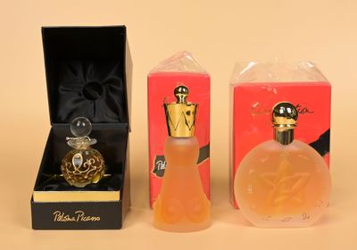 two perfume bottles in a box and a perfume bottle in a box