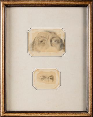 deux dessins encadrés représentant le visage d'un homme et les yeux d'une femme