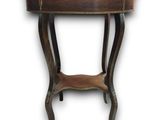 the table is made of wood and has a metal top