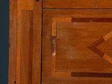 a close up of a wooden cabinet with a clock on it
