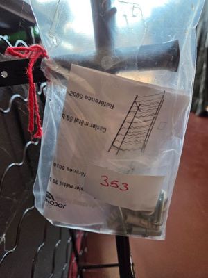 a plastic bag with a measuring tape attached to it