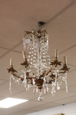 a chandelier hanging from the ceiling in a room