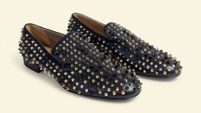 black studded loafer shoes on a white background