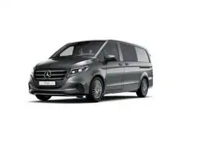 a grey mercedes van parked on a white background