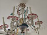 a chandelier that is hanging from the ceiling