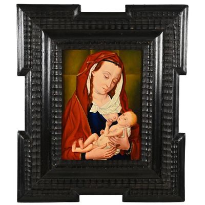 une image d'un tableau représentant une femme tenant un bébé dans ses bras