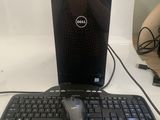 a dell laptop and a mouse on a desk