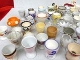 a lot of cups that are sitting on a table