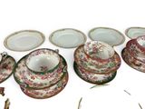many different plates and bowls on the table