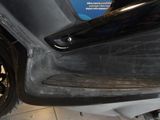 a close up of a car door handle with a sticker on it