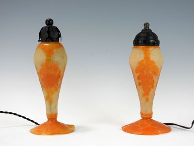 two lamps that are sitting on a white surface