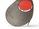 an image of a chair with a red cushion on it