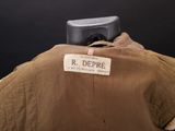 an old brown jacket with a label on it that says r depree