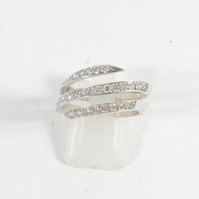 a close up of a diamond ring on a white background