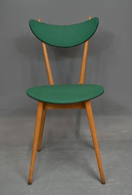 CHAISE dit "banane", piètement en bois, assise et dossier re…