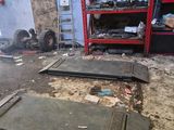 a lot of debris on the ground in a garage