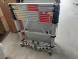a ladder that is sitting on the floor in a warehouse